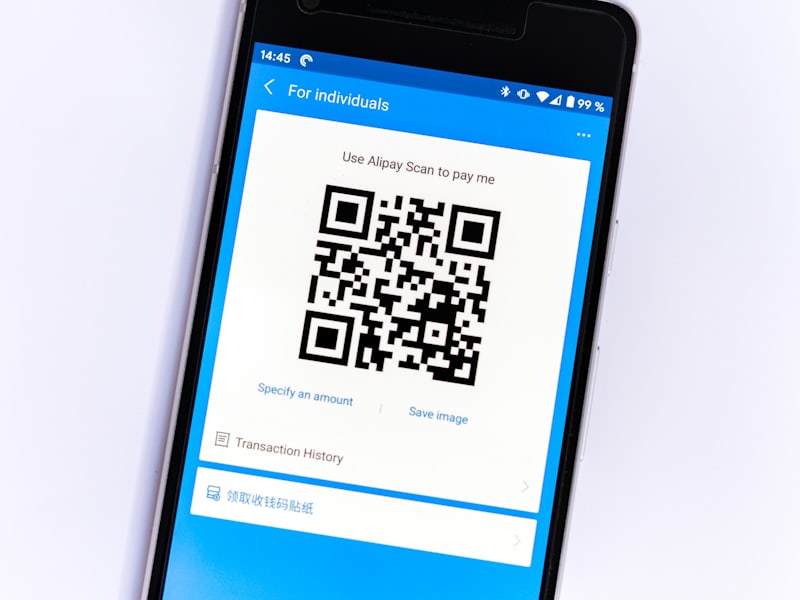A printed QR pass being presented at an accessible museum entrance